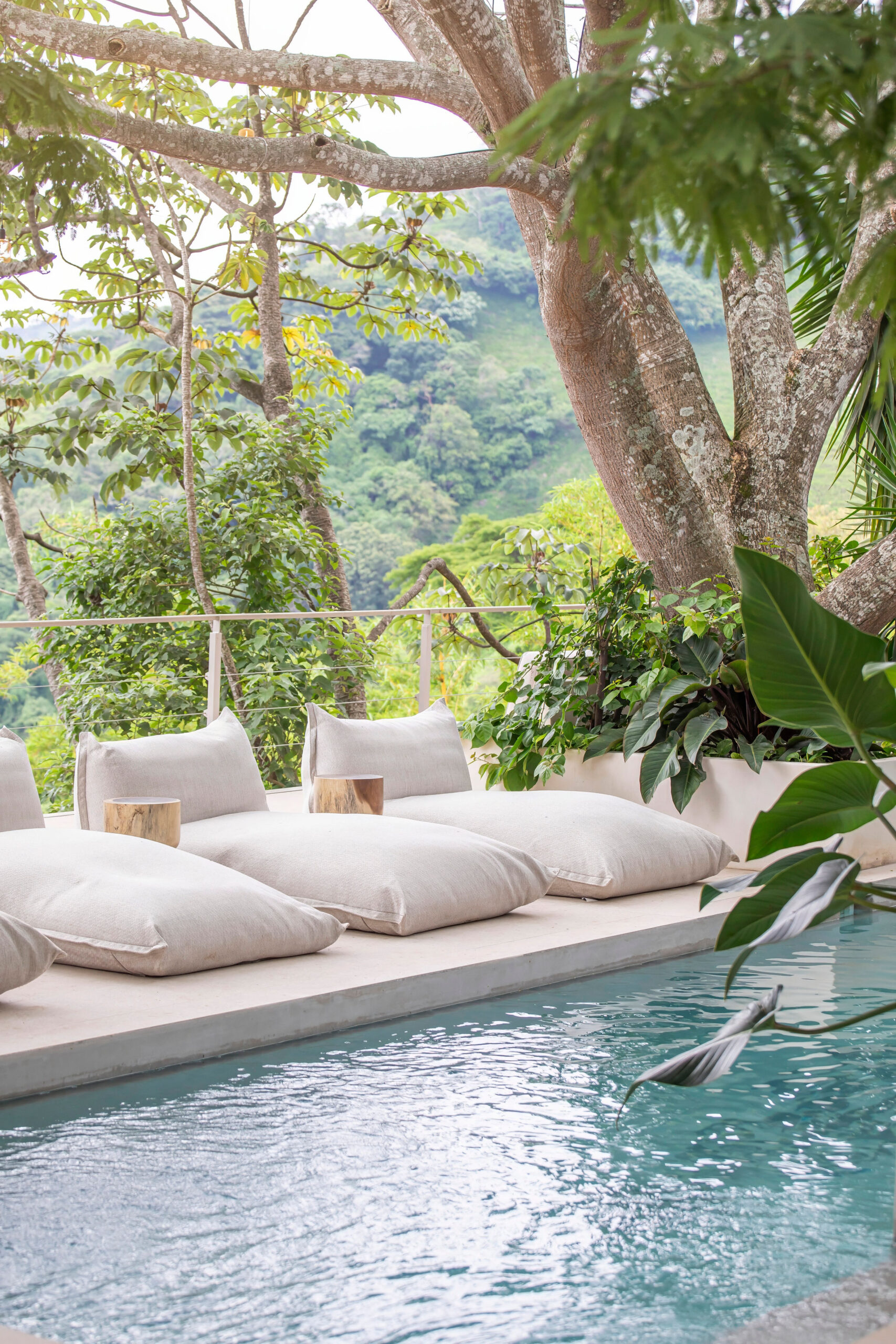 Poolside lounge surrounded by jungle in Costa Rica